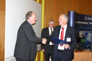 In March, Erwin Duhamel (r), head of security, strategic and partnership development office, European Space and Research Technology Center (ESTEC), receives a token of thanks from Rear Adm. Willem Voogt, RNLN (Ret.) (l), chapter president.
